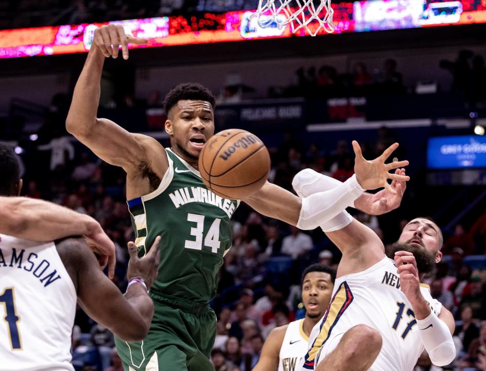 Pelicans center Jonas Valanciunas knocks the ball away from Bucks forward Giannis Antetokounmpo during the first half Thursday night at Smoothie King Center.