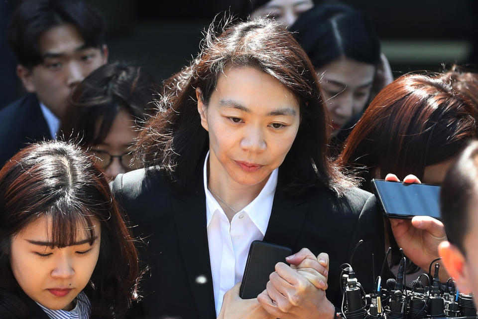 Former Korean Air executive Cho Hyun-ah, center, daughter of late Korean Air President Cho Yang-ho, leaves the Seoul Central District Court in Seoul, Thursday, May 2, 2019. Cho and his wife Lee Myung-hee, on Thursday attended the opening trial on her charges including illegal hiring of a Filipino maid. (Suh Myung-gon/Yonhap via AP)