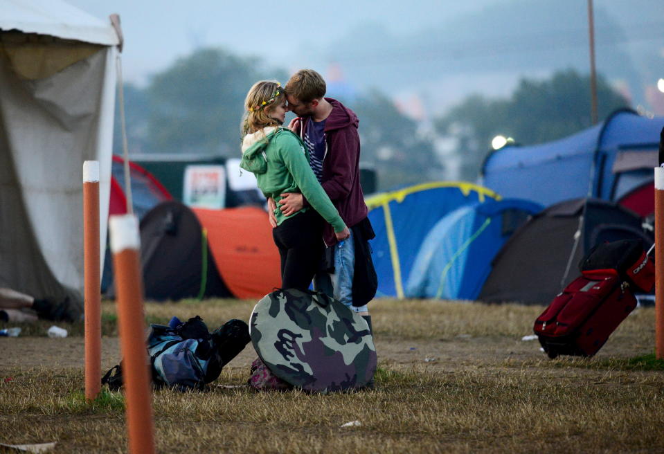 Revellers share a moment as they leave the festival in 2015.