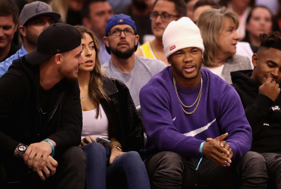 Kyler Murray of the Arizona Cardinals talks with Cody Bellinger of the Los Angeles Dodgers during the first half of the Phoenix Suns' loss to the Los Angeles Lakers at Talking Stick Resort Arena on Tuesday.