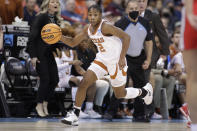 Texas guard Aliyah Matharu (2) dribbles the ball against Ohio State during the first half of a college basketball game in the Sweet 16 round of the NCAA tournament, Friday, March 25, 2022, in Spokane, Wash. (AP Photo/Young Kwak)