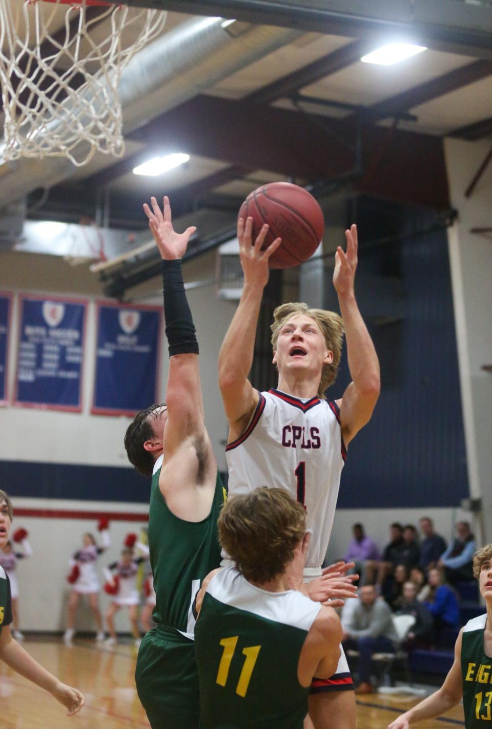 Cair Paravel's Simon Everhart drives to the rim against Maranatha Christian Academy on Wednesday, Feb. 7. Cair Paravel defeated Maranatha Academy 66-49.