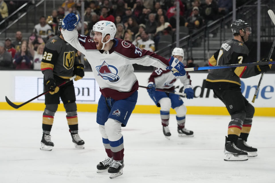 Colorado Avalanche left wing J.T. Compher (37) celebrates after scoring against the Vegas Golden Knights during the third period of an NHL hockey game Saturday, Feb. 26, 2022, in Las Vegas. (AP Photo/John Locher)