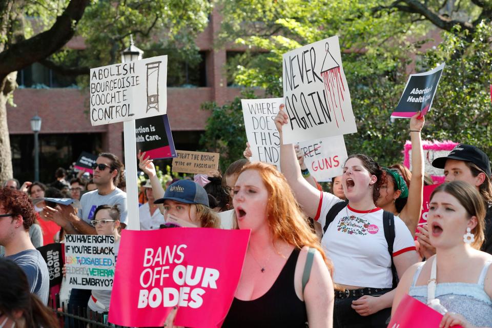Participants chant during Friday's abortion rights rally in Johnson Square.