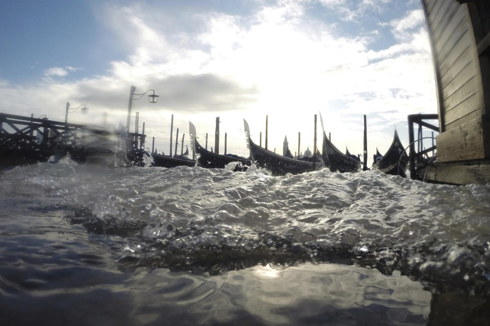 Water starts rising again in Venice, Italy, Saturday, Nov. 16, 2019. High tidal waters returned to Venice on Saturday, four days after the city experienced its worst flooding in 50 years. (AP Photo/Luca Bruno)