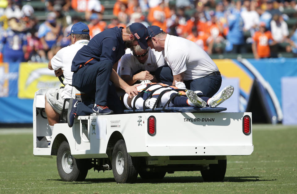 DeVante Bausby of the Denver Broncos was carted off the field in the first half on Sunday against the Chargers. (Getty Images)