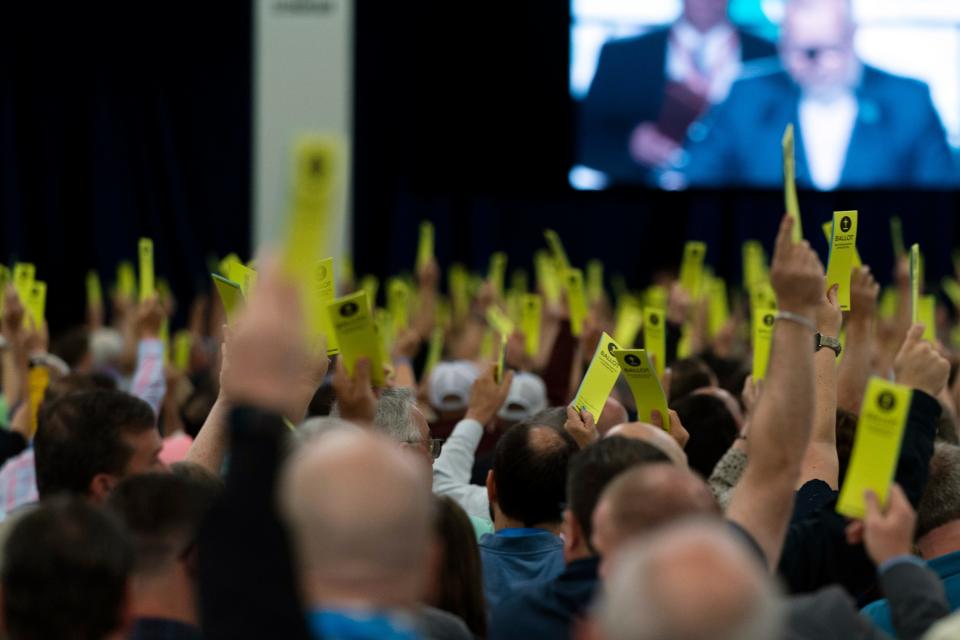 Attendees hold up their ballots during a session at the Southern Baptist Convention's annual meeting in Anaheim, Calif., Tuesday, June 14, 2022. (AP Photo/Jae C. Hong)