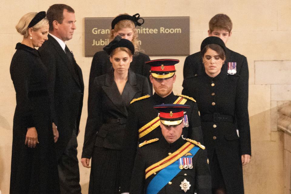 Britain's Prince William, Prince of Wales leads his brother Britain's Prince Harry, Duke of Sussex, followed by their cousins Britain's Princess Beatrice of York and Britain's Princess Eugenie of York, Britain's Lady Louise Windsor and Britain's James, Viscount Severn, and Zara Tindall and Peter Phillips before mounting a vigil around the coffin of their grandmother Queen Elizabeth II, in Westminster Hall, at the Palace of Westminster in London on September 17, 2022, ahead of her funeral on Monday. - Queen Elizabeth II will lie in state in Westminster Hall inside the Palace of Westminster, until 0530 GMT on September 19, a few hours before her funeral, with huge queues expected to file past her coffin to pay their respects. (Photo by Ian Vogler / POOL / AFP) (Photo by IAN VOGLER/POOL/AFP via Getty Images)