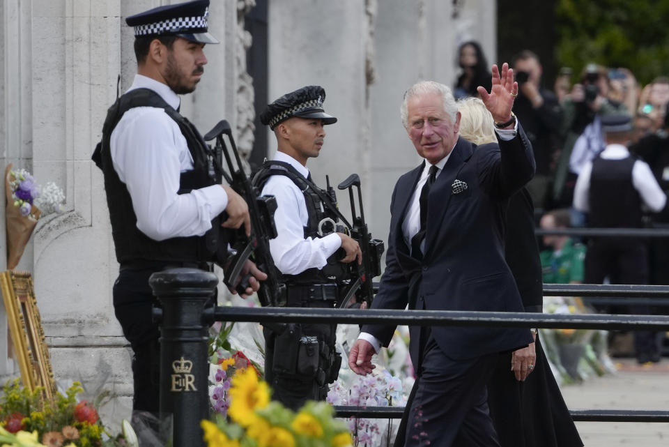 King Charles III and Camilla, the Queen Consort, arrive at Buckingham Palace in London, Friday, Sept. 9, 2022. Queen Elizabeth II, Britain's longest-reigning monarch and a rock of stability across much of a turbulent century, died Thursday Sept. 8, 2022, after 70 years on the throne. She was 96. (AP Photo/Kirsty Wigglesworth)