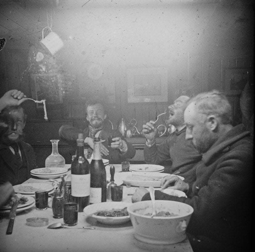 Dinner in the wardroom: from left, Arctowski, Amundsen, Lecointe, Racovitza and de Gerlache. - Library of Congress; P&P