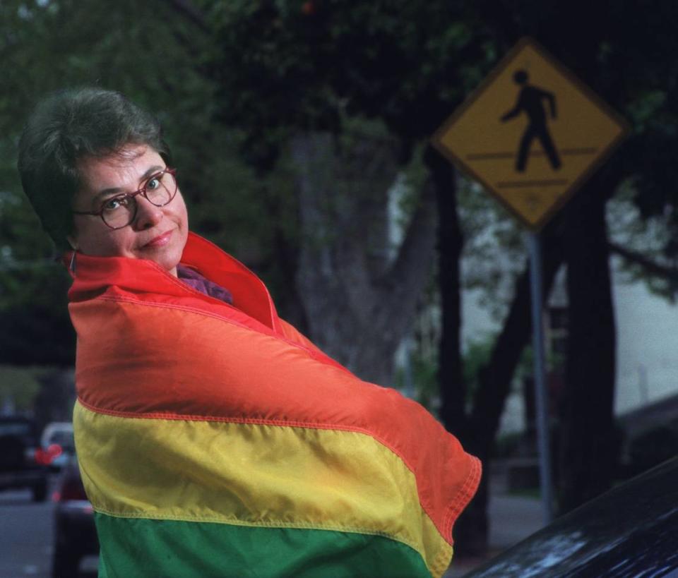 Linda D. Birner, publisher and editor of LGBTQ newspaper Mom... Guess What!, wears her rainbow pride flag in 1998 in midtown Sacramento as her publication was marking its 20th anniversary.
