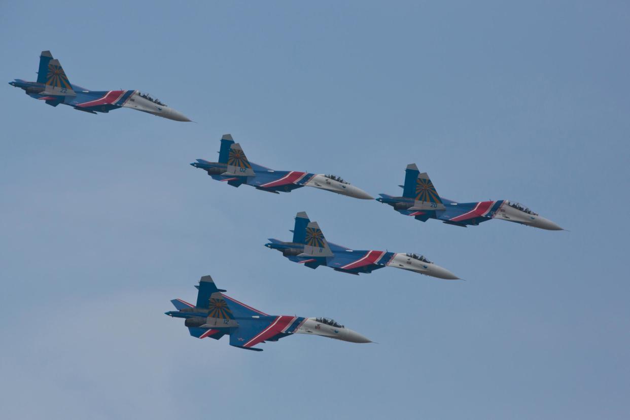Su-27 jets of the Russian Airforce 'Knigths' Aerobatic team performs air show: VCG via Getty Images)