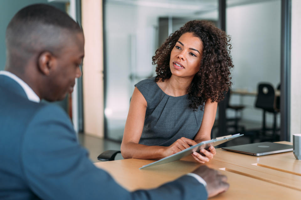 woman interviewing a man for a job