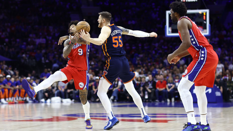 Kelly Oubre Jr. #9 of the Philadelphia 76ers and Isaiah Hartenstein #55 of the New York Knicks challenge for the ball during the first quarter of game four of the Eastern Conference First Round Playoffs at the Wells Fargo Center on April 28, 2024 in Philadelphia, Pennsylvania.