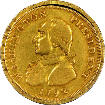 A one-of-a-kind gold coin believed to have once been a cherished memento of U.S. President George Washington is displayed in this handout image released June 12, 2018. Numismatic Guarantee Corporation/Handout via REUTERS