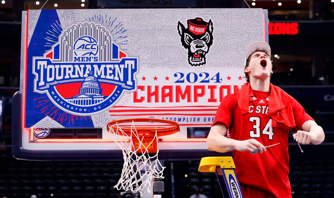 N.C. State’s Ben Middlebrooks (34) celebrates after cutting the net after the Wolfpack’s 84-76 victory over UNC in the championship game of the 2024 ACC Men’s Basketball Tournament at Capital One Arena in Washington, D.C., Saturday, March 16, 2024.