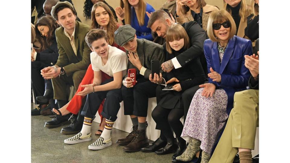 family sat in front row at fashion show