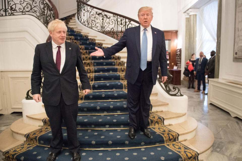 Pictured is Donald Trump (right) introducing Boris Johnson at the G7 summit in France on Sunday.