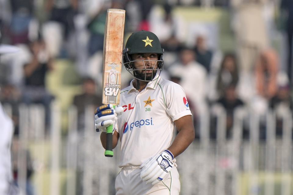 Pakistan's Abdullah Shafique celebrates after scoring fifty during the second day of the first test cricket match between Pakistan and England, in Rawalpindi, Pakistan, Friday, Dec. 2, 2022. (AP Photo/Anjum Naveed)