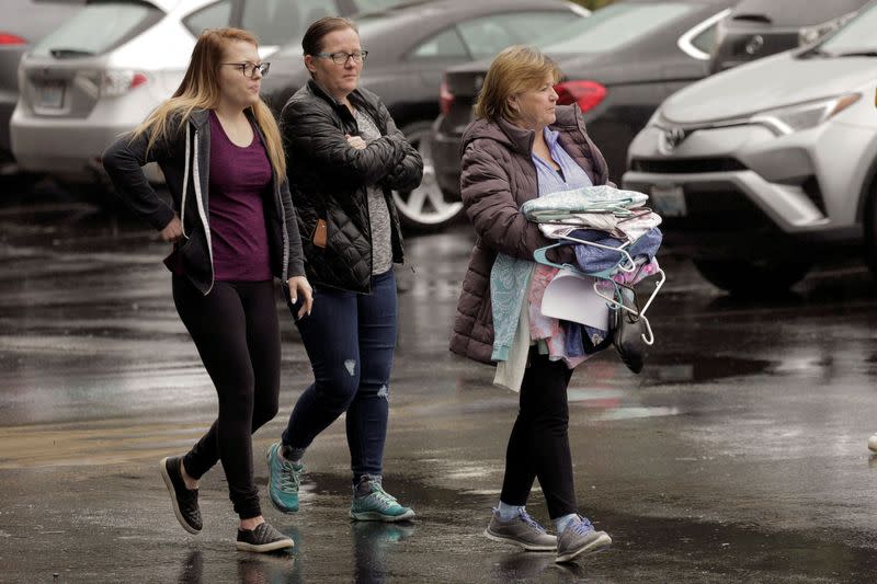 People are seen at the Life Care Center of Kirkland, the long-term care facility linked to several confirmed coronavirus cases, in Kirkland