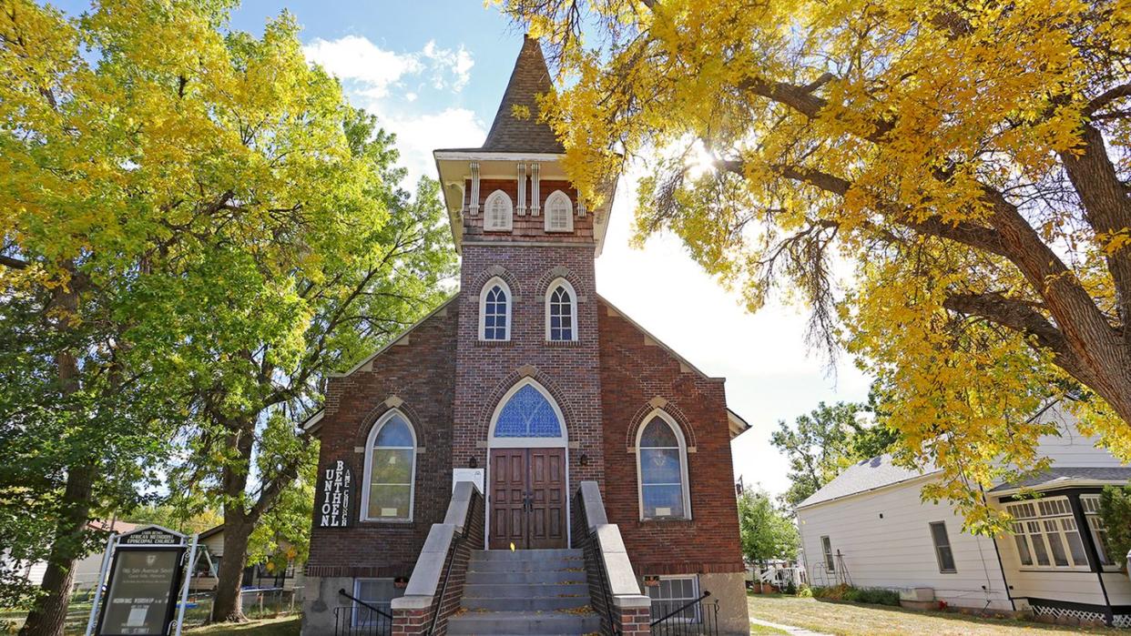 a brick building with stairs leading up to it