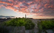 <p>Cape May is a postcard-ready seaside resort where horse-drawn carriages shepherd visitors around streets lined with Victorian houses, many of which are now romantic inns and B&Bs. A compact town center, chock full of antique stores, fudge shops, and local boutiques keep families coming back year after year. After a day in the sand, locals converge outside the Beach Shack Hotel for happy hour at the Rusty Nail, an outdoor tiki bar with a firepit. Order the bar’s signature Hammer cocktail, a potent combination of spiced rum, coconut rum, passion fruit puree, and fresh lemon and pineapple juices.</p>