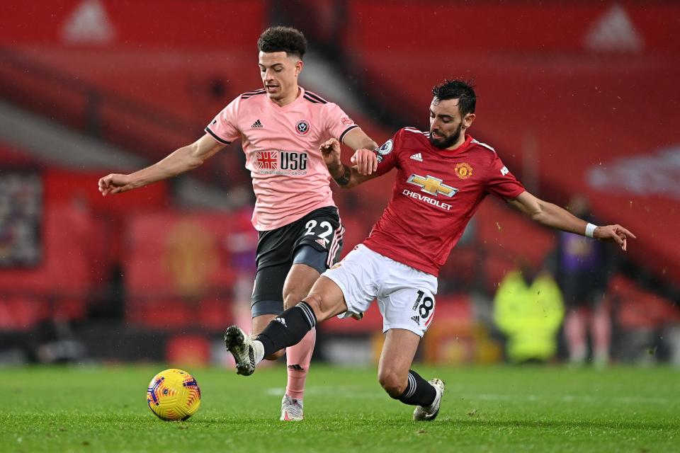 Ethan Ampadu (left) battles for the ball with Bruno FernandesGetty Images