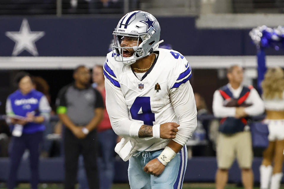 Dallas Cowboys quarterback Dak Prescott (4) celebrates after throwing a pass to Brandin Cooks, not pictured, for a two-point conversion in the second half of an NFL football game against the Seattle Seahawks in Arlington, Texas, Thursday, Nov. 30, 2023. (AP Photo/Roger Steinman)