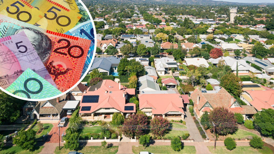 A composite image of Australian money and the aerial view of houses in a suburban area of Australia to represent mortgage payments rising.