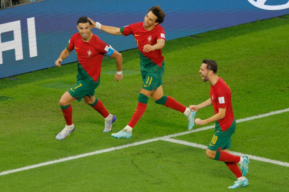 Ronaldo celebrates with Joao Felix (centre) and Bernardo Silva (AFP via Getty Images)