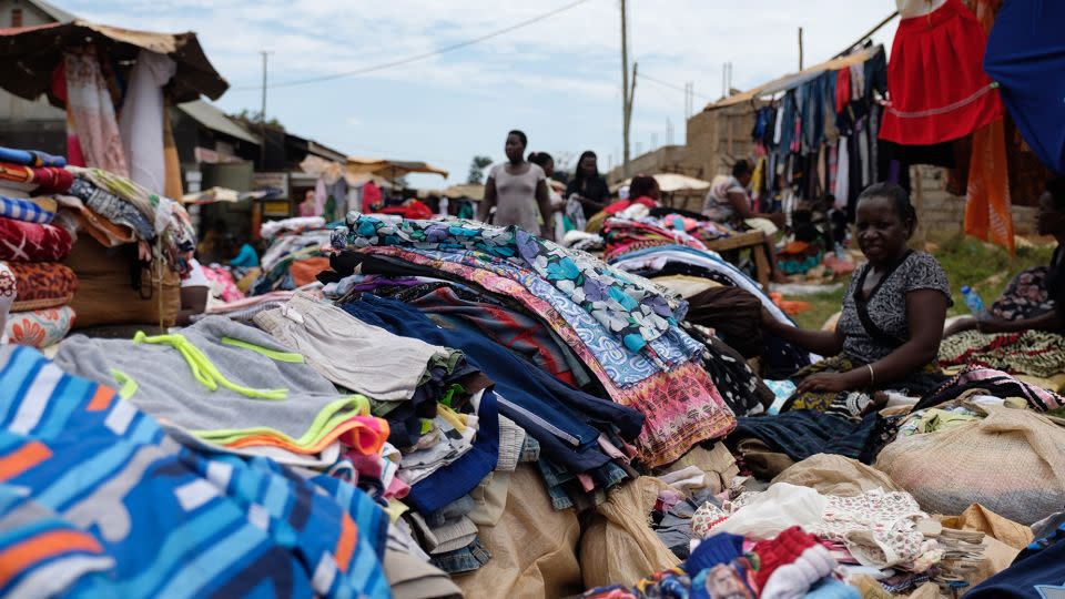 Fast fashion has led to a glut of low-value clothing that inordinately burdens developing countries, as shown here at a local market in the Entebbe district of Kampala, Uganda, in 2018. - Camille Delbos/Art In All of Us/Corbis/Getty Images