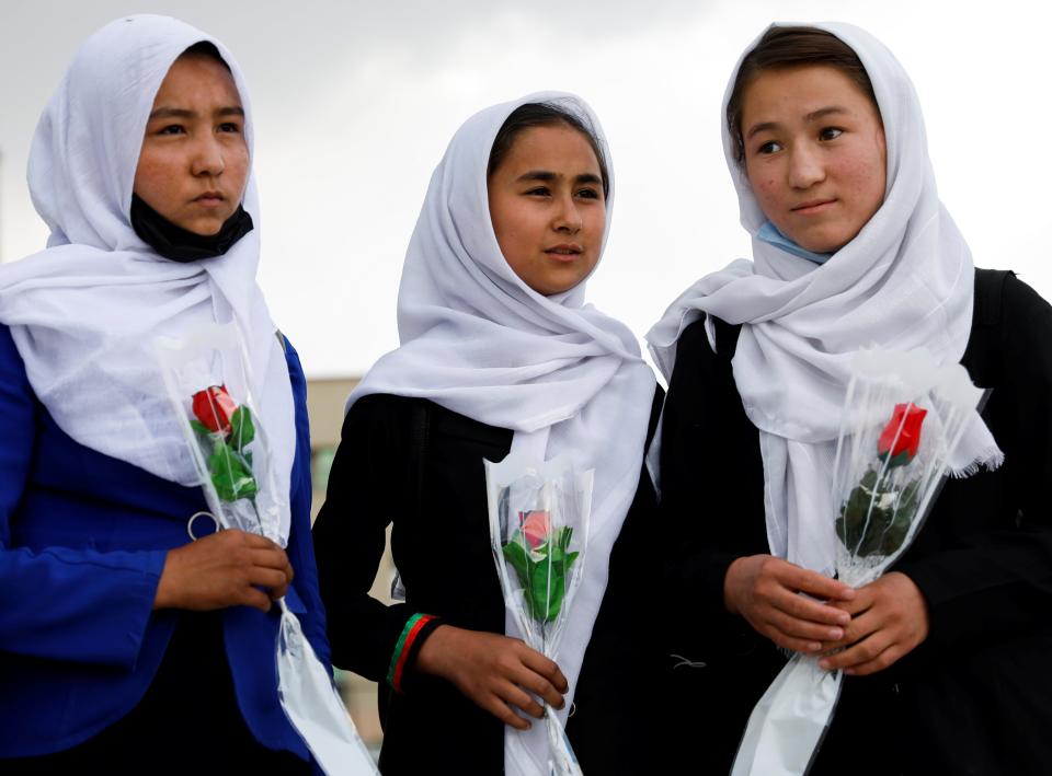 Schoolgirls arrive at a hospital in Kabul to visit students who were injured in a car bomb blast on SaturdayReuters