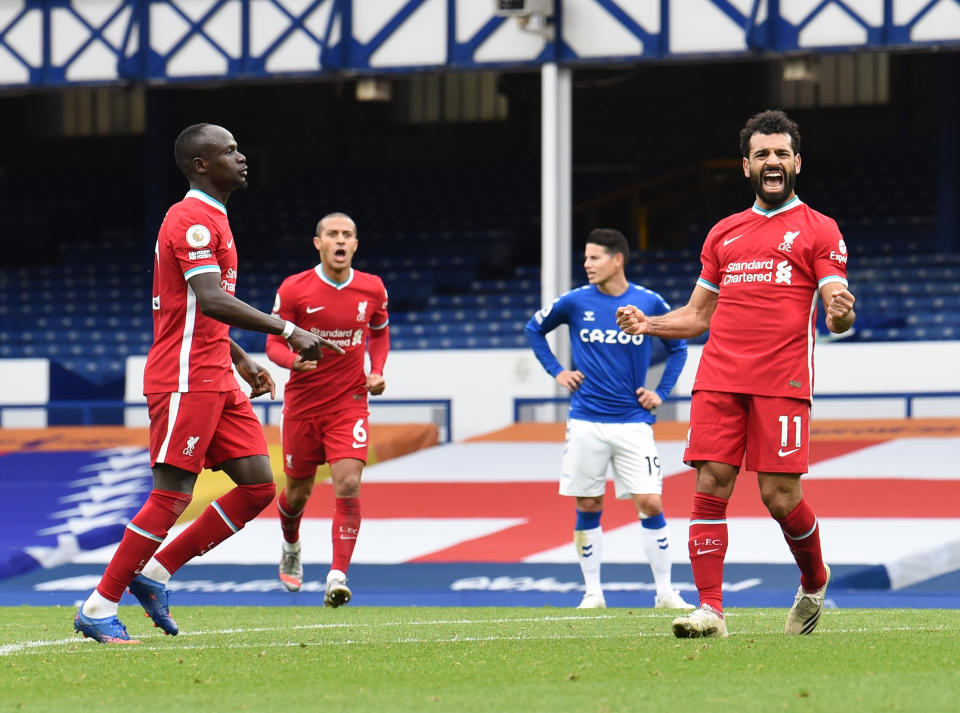 LIVERPOOL, ENGLAND - OCTOBER 17: (THE SUN OUT, THE SUN ON SUNDAY OUT )Mohamed Salah of Liverpool scores the second goal making the score 2-1 and celebrates during the Premier League match between Everton and Liverpool at Goodison Park on October 17, 2020 in Liverpool, England. Sporting stadiums around the UK remain under strict restrictions due to the Coronavirus Pandemic as Government social distancing laws prohibit fans inside venues resulting in games being played behind closed doors. (Photo by John Powell/Liverpool FC via Getty Images)