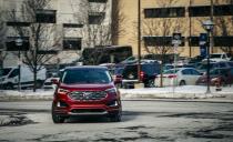 <p>The looks of this Ruby Red, all-wheel-drive Edge Titanium model, which wore beefy 20-inch wheels (19s are standard), drew mixed reviews. While some of us appreciate the Ford's snub nose, tight proportions, and short greenhouse, others see a bloated hatchback.</p>
