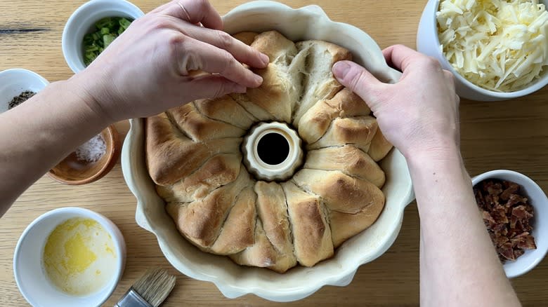 Pulling apart bread loaf