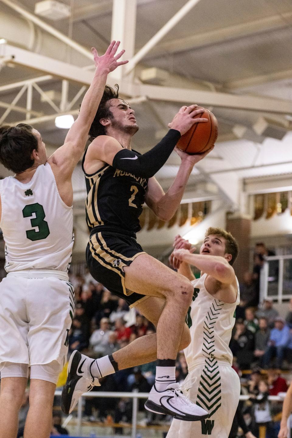 Noblesville High School senior Luke Almodovar (2) shoots during the first half of an IHSAA Sectional basketball game against Westfield High School, Friday, March 3, 2023, at Carmel High School.