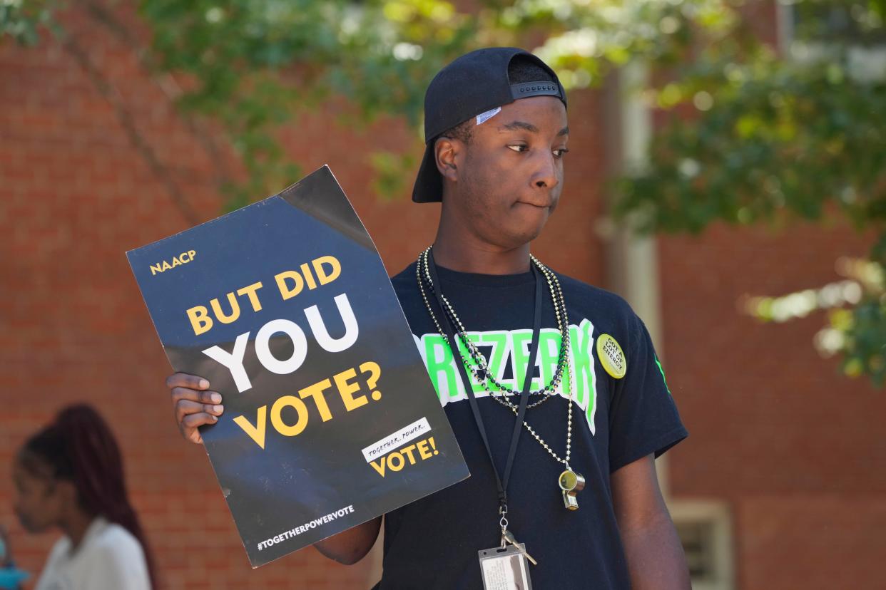 A Jackson State University student holds a sign stressing the importance of voting during a JSU Votes Civic Engagement Initiative on National Voter Registration Day, Sept. 19, 2023, on the Jackson, Miss., campus.