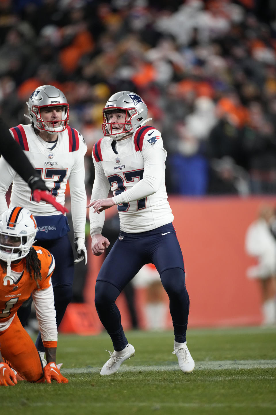 New England Patriots place-kicker Chad Ryland (37) kicks the game winning field goal with second left during the second half of an NFL football game against the Denver Broncos, Sunday, Dec. 24, 2023, in Denver. (AP Photo/David Zalubowski)