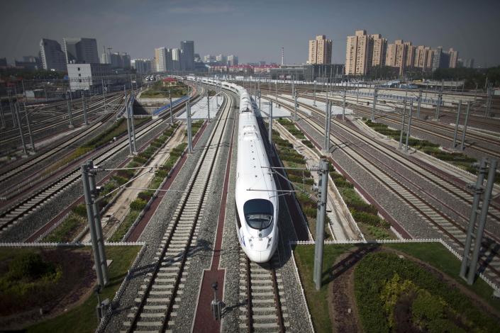 A CRH high-speed train leaves the Beijing South Station for Shanghai during a test run on the Beijing-Shanghai high-speed railway in Beijing, Monday, June 27, 2011. China's bullet train builders have conducted a test run of their showcase Beijing-to-Shanghai line amid controversy over the system's high cost. (AP Photo/Alexander F. Yuan)