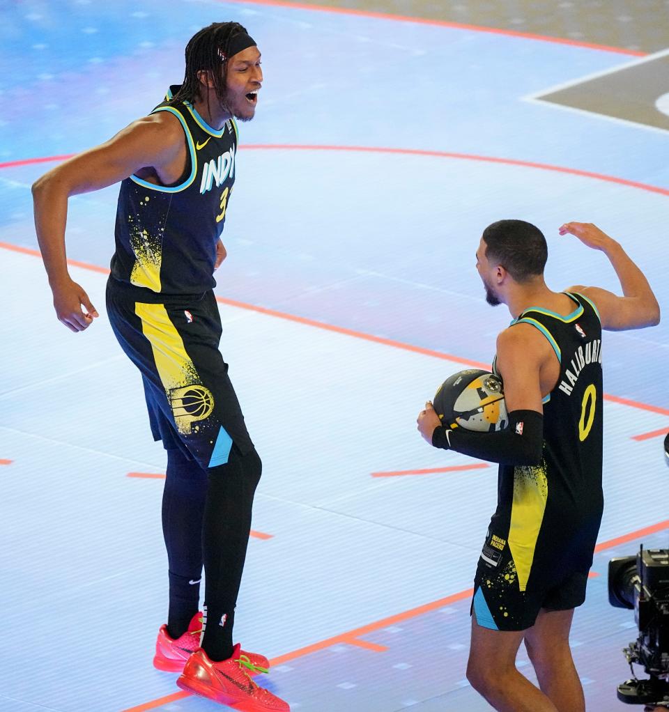 Indiana Pacers center Myles Turner (33) and Indiana Pacers guard Tyrese Haliburton (0) celebrate during the skills challenge Saturday, Feb. 17, 2024, during NBA All-Star Saturday Night at Lucas Oil Stadium in downtown Indianapolis.