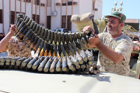 Members of the Libyan internationally recognised government forces prepare ammunition to head out from Misrata to the front line in Tripoli, Misrata, Libya May 9, 2019. REUTERS/Ayman Al-Sahili