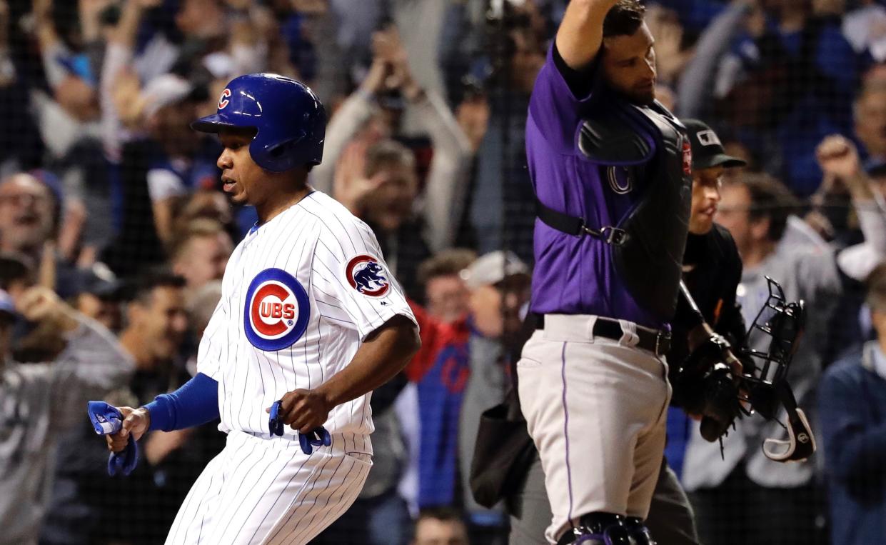 Terrance Gore did his best acting job to earn first base and save the Cubs’ season before video replay showed definitively that he was not hit by a pitch. (AP)