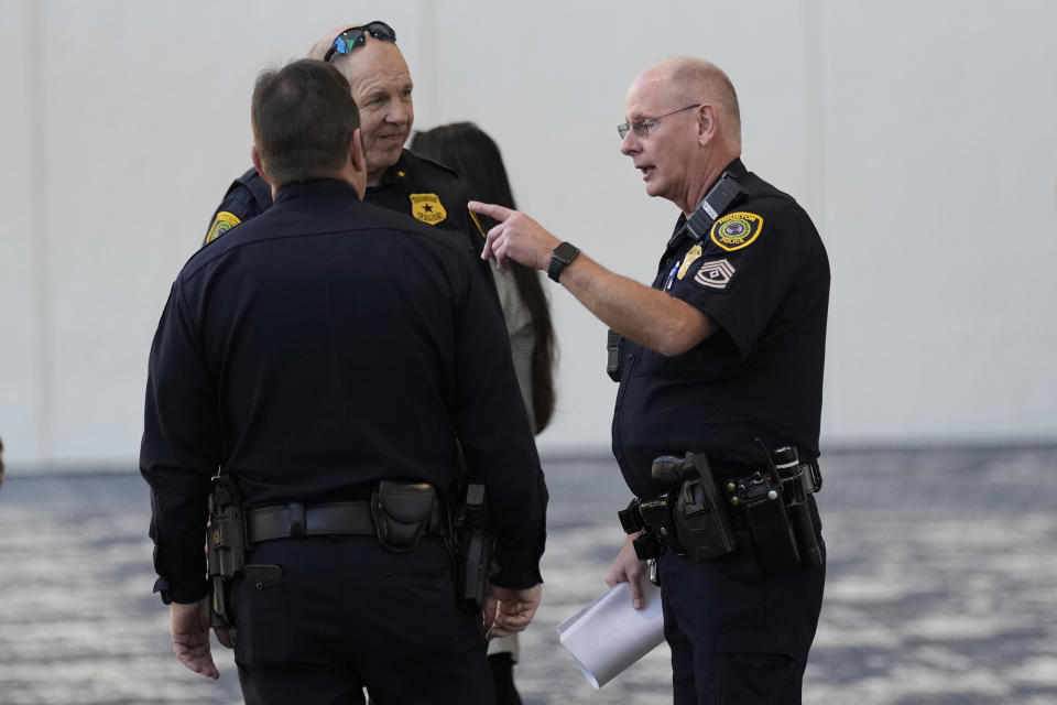 Houston Police Officers gather in the lobby of Lakewood Church Sunday, Feb. 18, 2024, in Houston. Pastor Joel Osteen welcomed worshippers back to Lakewood Church Sunday for the first time since a woman with an AR-style opened fire in between services at his Texas megachurch last Sunday. (AP Photo/David J. Phillip)