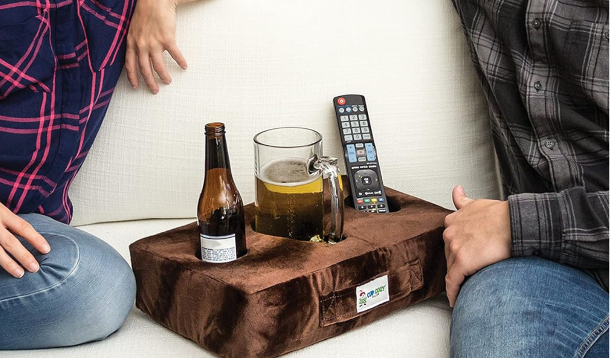 Avoid Super Bowl spills, thanks to this cup pillow that’ll hold your drinks on the couch — just  at Amazon