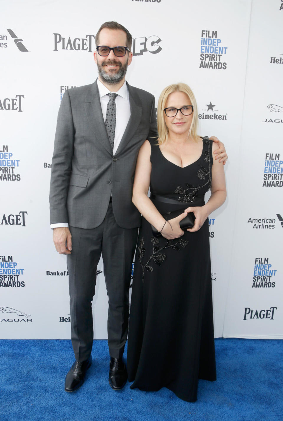 Patricia Arquette in a black embroidered dress with her husband, Eric White, at the Film Independent Spirit Awards on Feb. 27, 2016.