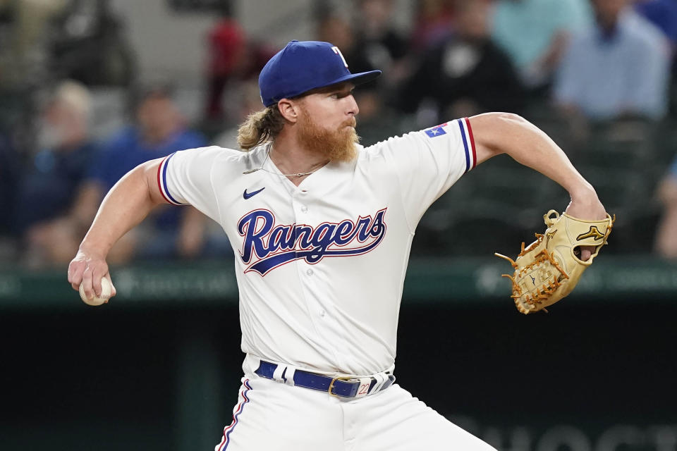 Texas Rangers starting pitcher Jon Gray throws during the first inning of a baseball game against the Baltimore Orioles in Arlington, Texas, Monday, April 3, 2023. (AP Photo/LM Otero)