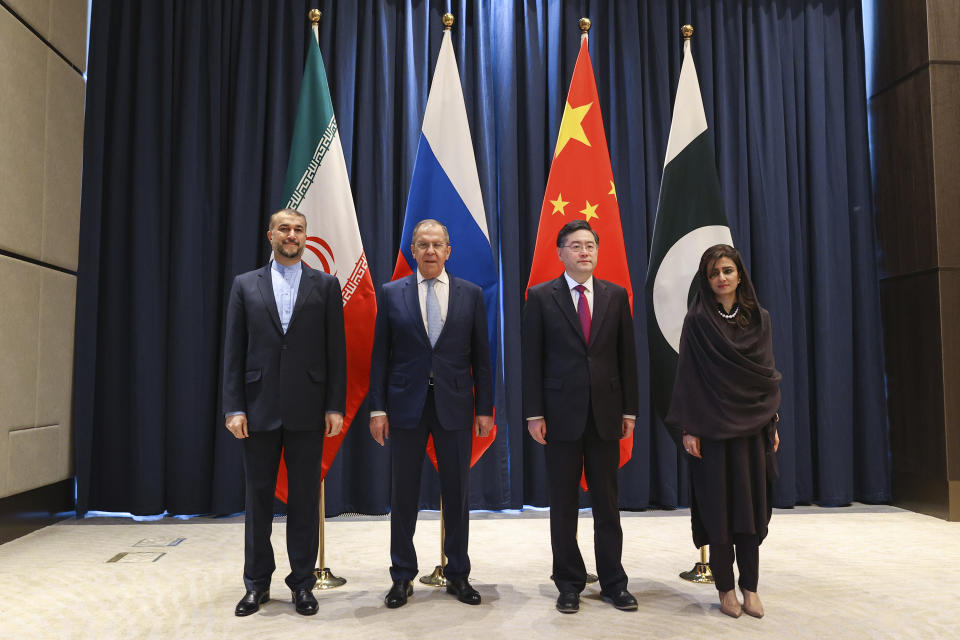 In this handout photo released by Russian Foreign Ministry Press Service, from left: Iranian Foreign Minister Hossein Amir-Abdollahian, Russian Foreign Minister Sergey Lavrov, Chinese Foreign Minister Qin Gang and Pakistani Minister of State for Foreign Affairs Hina Rabbani Khar pose for a group photo during a ministerial meeting in Samarkand, Uzbekistan, Thursday, April 13, 2023. (Russian Foreign Ministry Press Service via AP)