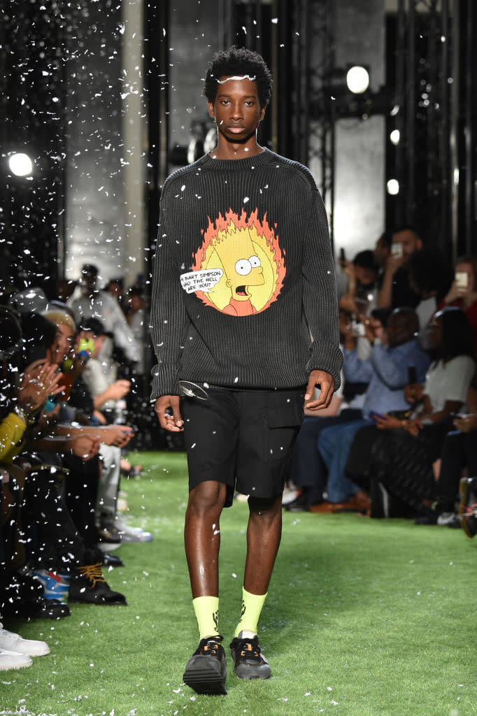 <p>Model wears black ribbed sweater with Bart Simpson graphic, paired with black shorts and sneakers, at the Spring 2019 Off-White men’s show in Paris. (Photo: Getty Images) </p>