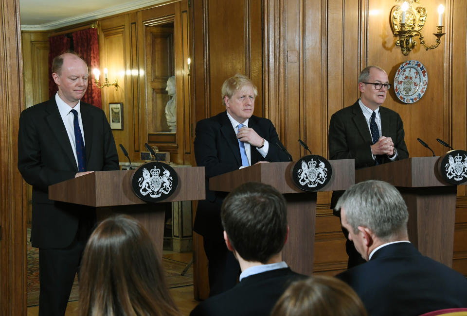 FILE - In this Monday, March 9, 2020 file photo, from left, Chief Medical Officer for England Chris Witty, Britain's Prime Minister Boris Johnson and Chief Scientific Adviser Patrick Vallance speak during a press conference about coronavirus in 10 Downing Street in London. Britain botched its response to the coronavirus the first time around. Now many scientists fear it’s about to do it again. The virus is on the rise again in the U.K., which has recorded almost 42,000 COVID-19 deaths, with confirmed infections at their highest level since May. (AP Photo/Alberto Pezzali, File)