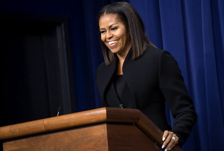 Michelle Obama flashes a smile at the White house screening of 